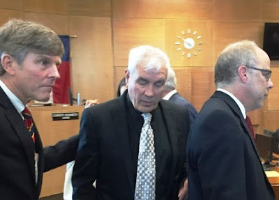 Kerry Max Cook (center) and his team of lawyers