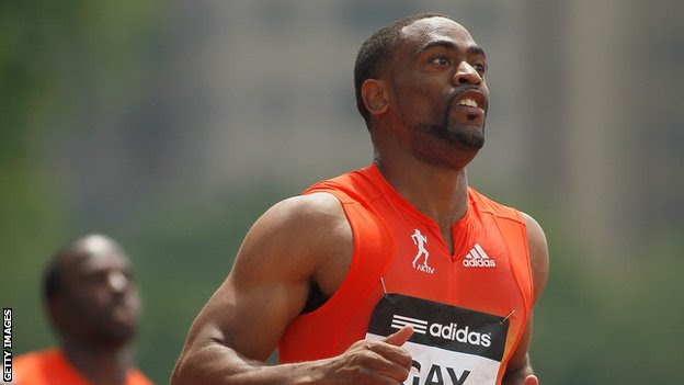 Tyson Gay warms down