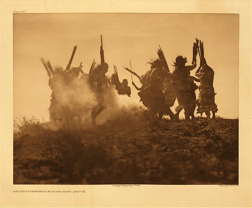 Edward S. Curtis.  Dancing to restore an eclipsed moon - Qagyuhl (The North American Indian; v.10)