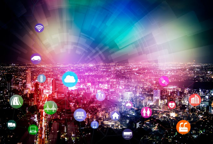 Internet of Things connecting in cloud over city scape.