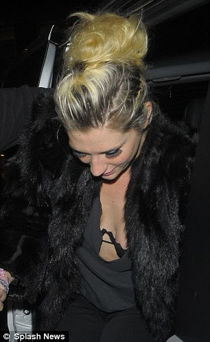 Oops-a-daisy! The starlet almost suffered a wardrobe malfunction in her revealing top 