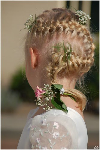 Here's a great hairstyle for your little flower girl-- a french braid that