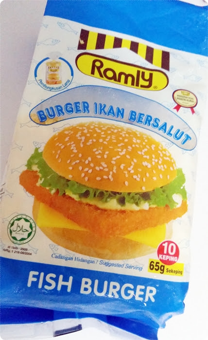 A package of Ramly Fish Burgers, showing the logo, product name, and serving suggestion. Contains 10 pieces, 65g each. Halal certified.