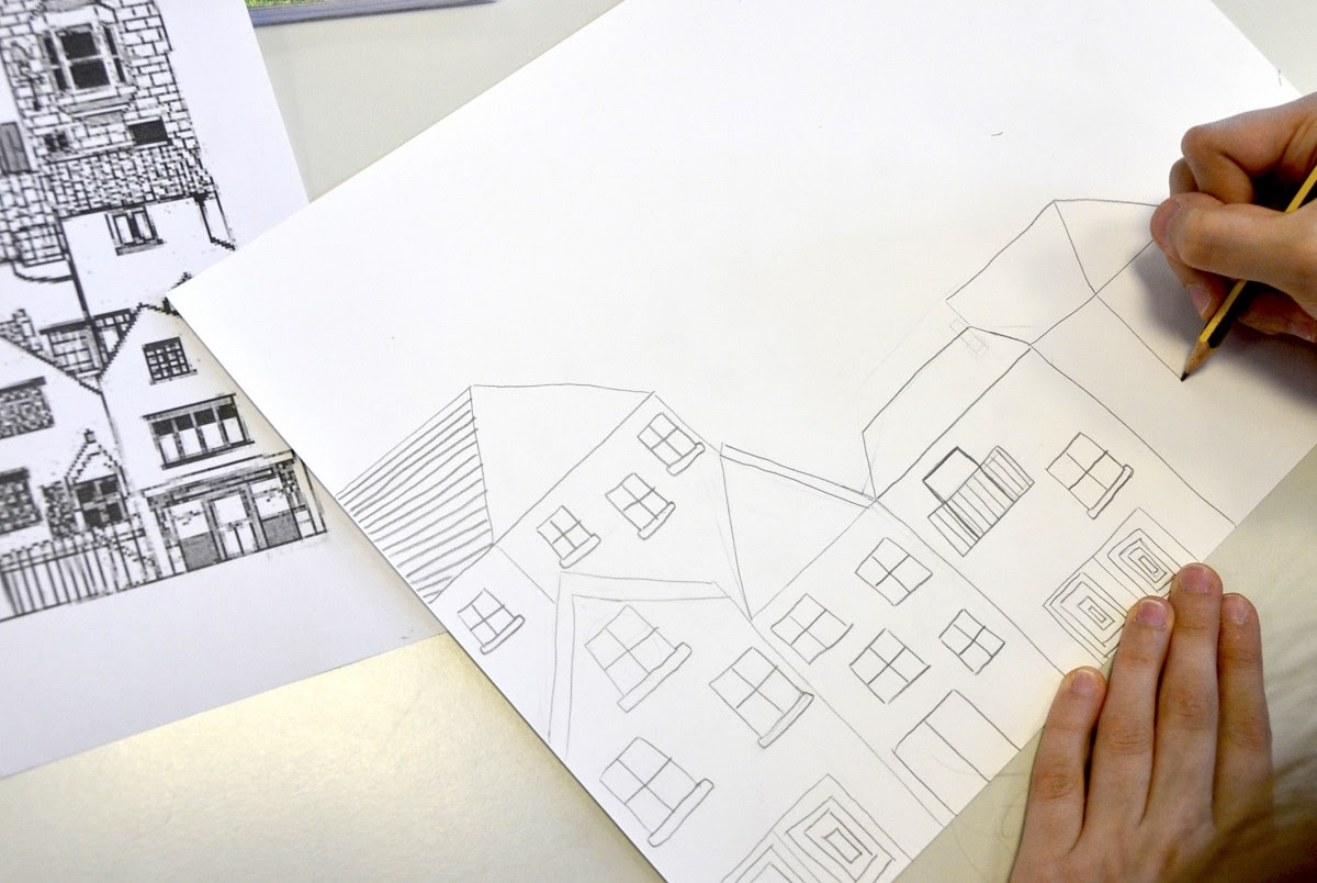 Dopo aver disegnato il villaggio a matita con due o tre file di case sovrapposte gli studenti hanno diviso a met  il disegno con una linea