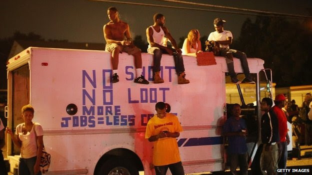 Demonstrators protest the killing of teenager Michael Brown on August 17, 2014 in Ferguson, Missouri. 