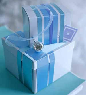 White gift boxes with blue ribbons wrapped around