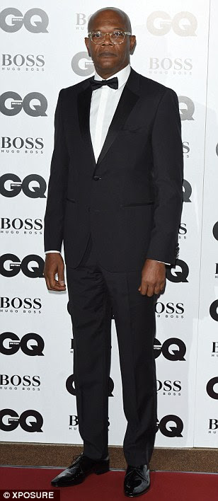 Back in town: Douglas Booth arrived back from Los Angeles to enjoy the show wearing a traditional tuxedo just like Burberry creative director Christopher Bailey and Samuel L. Jackson