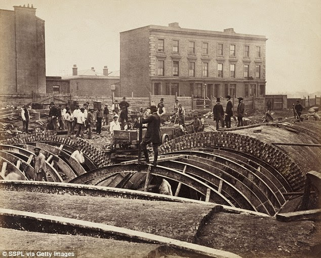 Men at work: This photo by Henry Flather shows the construction, undertaken between 1866 and 1870, of the Metropolitan District Railway's underground lines which included the destruction of houses