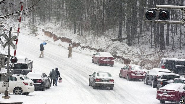 Motorists abandoned their vehicles along Georgia Highway 140 in Canton, Georgia, on 28 January 2014 