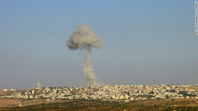 A handout photo from the Shaam News Network shows smoke rising after a Syrian Air Force fighter jet fired missiles at the suburbs of the northern province of Idlib, Syria, on Tuesday, October 16. Click through the gallery to view images of the war-torn country in October. See photographs from September.
