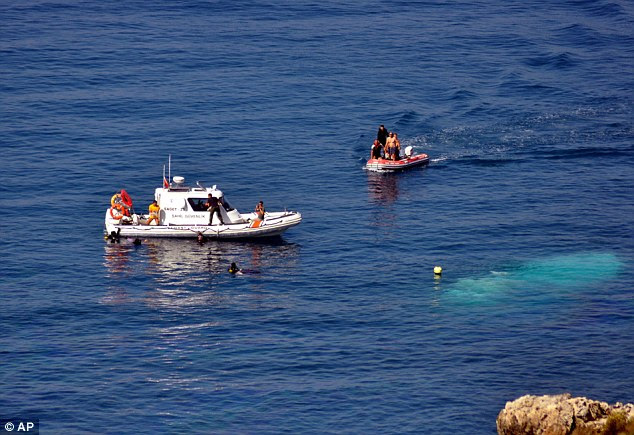 Disaster: Rescue teams with divers search around the waters off the Aegian coast