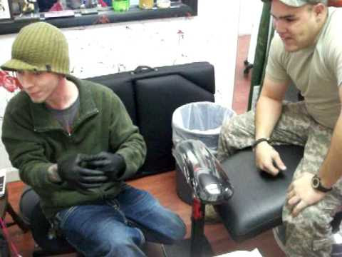 crazy man gets tattooed under his finger nail at Southside Tattoo in flint 