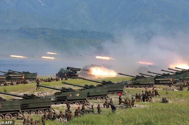 North Korea (pictured during a military exercise) may be preparing for its sixth nuclear weapon test, South Korean officials have warned 