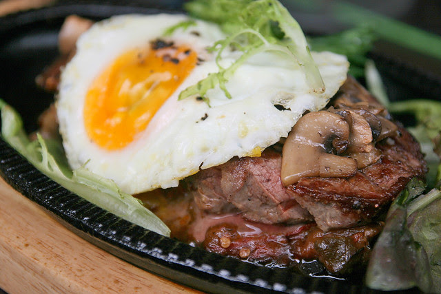 Grilled Ribeye (120g) with Chachouka, Fried Egg And Grilled Mushrooms