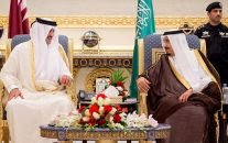 King Salman of Saudi Arabia, right, welcomes Qatar's Emir Sheikh Tamim bin Hamad Al-Thani upon his arrival to Riyadh Airbase before the opening of Gulf Cooperation Council summit in Riyadh, Saudi Arabia, May 5, 2015. (Saudi Press Agency/AP)