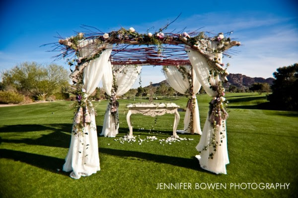 Show Stoppers constructed a charming custom arbor using white birch 