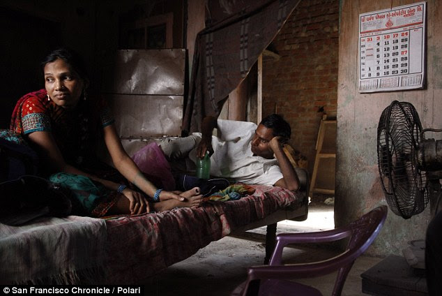 Together again: Manisha and Raman Parmar rest after their two-hour journey from the Akanksha Infertility Clinic to their home in Khambhat