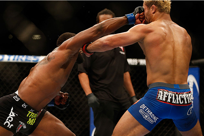 LAS VEGAS, NV - NOVEMBER 16:  (L-R) Tyron Woodley punches Josh Koscheck in their welterweight bout during the UFC 167 event inside the MGM Grand Garden Arena on November 16, 2013 in Las Vegas, Nevada. (Photo by Donald Miralle/Zuffa LLC/Zuffa LLC via Getty Images) *** Local Caption *** Josh Koscheck; Tyron Woodley