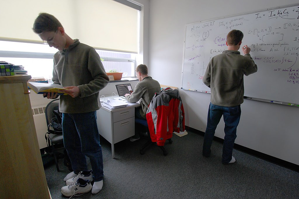 Three copies of me, working in my office.