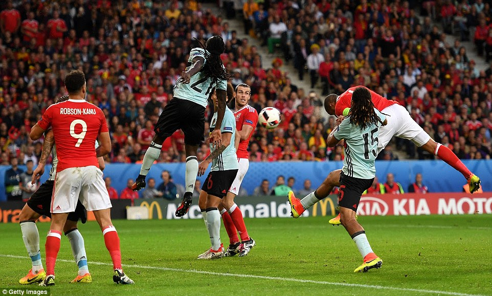 Wales captain Ashley Williams rises, almost unmarked, seven yards out to meet Aaron Ramsey's corner and head in the equaliser