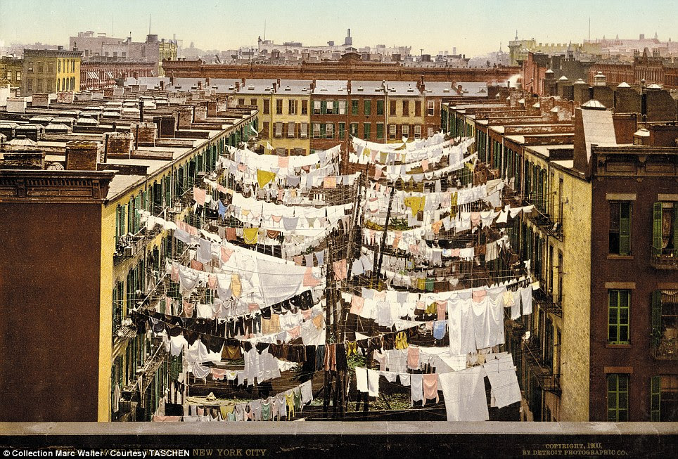 Laundry day: This unusual picture shows a Monday in New York City, when the streets were filled with clean washing being aired among the buildings