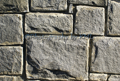 various sizes of granite blocks in a wall