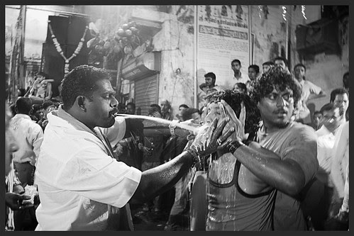 Spitting Milk In The Mouth To Seamlessly Remove The Rods From The Mouth After The Rod Piercing Ritual by firoze shakir photographerno1