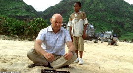 Locke teaching Walt how to play backgammon.