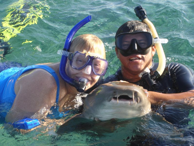 Gina and Eddie hold a Shark