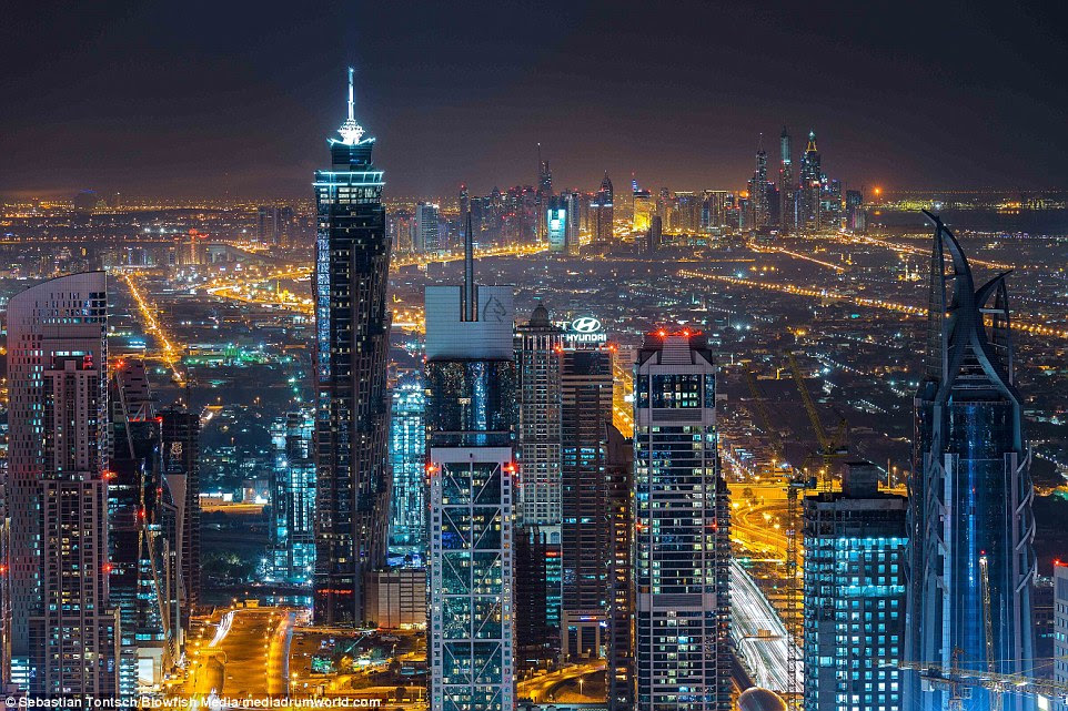 At night, the scale of the city becomes apparent as it puts on a mesmerising light show for those who live or work in skyscrapers