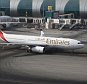 DRK9XM Emirates Airlines Airbus A330-200 taxiing out for departure from Dubai International Airport, UAE