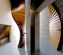 Constructed from 40 planks of Burma teak, this door contains fabulously intricate inner mechanisms including a wire rope and hidden counterweight to create its dynamic opening effect. It looks just like an ordinary oversized door when closed, but fans out into a beautiful curved opening.