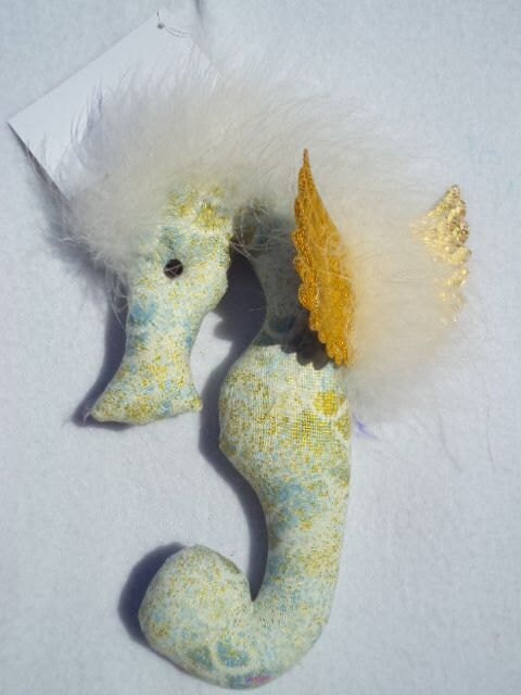 Angel, seahorse, gold, feathers, ornament for Christmas tree, wreath, or package