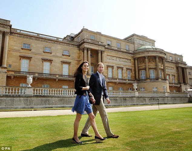Newly-weds: Duke and Duchess of Cambridge walk hand in hand from Buckingham Palace as they prepare to board a helicopter to fly off on their honeymoon