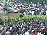 French tank and Ivorian demonstrators at a rally in Abidjan