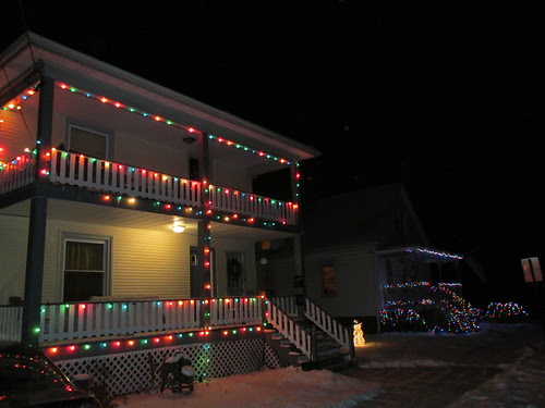 Houses decorated with outdoor Christmas lights on Elm Street.  Morton grove Illinois.  December 2013. by Eddie from Chicago
