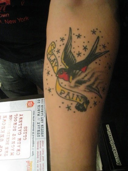 tattoo intertwining words play and pain