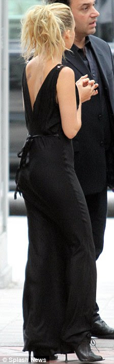 Toned: Nicole's dress clung to all the right places and highlighted her slender figure