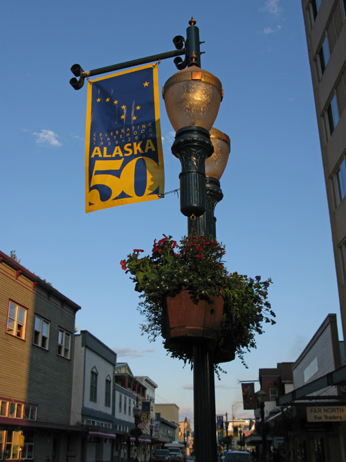 a banner celebrating Alaska's 50th Anniversary as a US state, South Franklin Street, Juneau