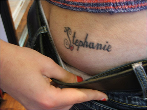 Tattoo reading 'Stephanie' on Rachel's hip. Stephanie has one reading 
