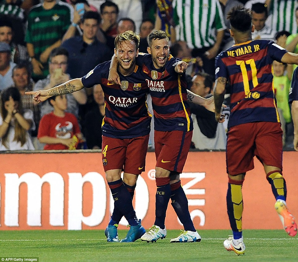 Croatian midfielder Ivan Rakitic (L) celebrates his goal which put Barcelona ahead shortly after half-time with defender Jordi Alba