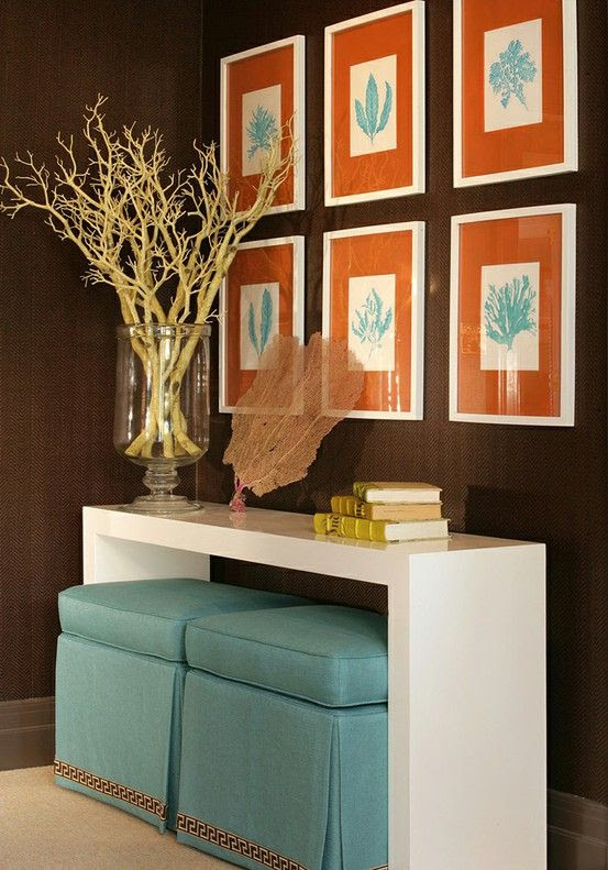 Orange and blue are complementary colors because they are directly accross from each other on the colors wheel. So even with brown added to this room, they still compliment each other. Color scheme for laundry room?