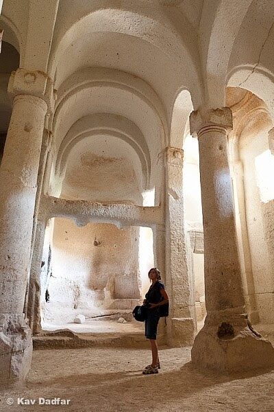 My tripod and flash are positioned behind the pillar on the left to give me a bit of light onto the woman's face.