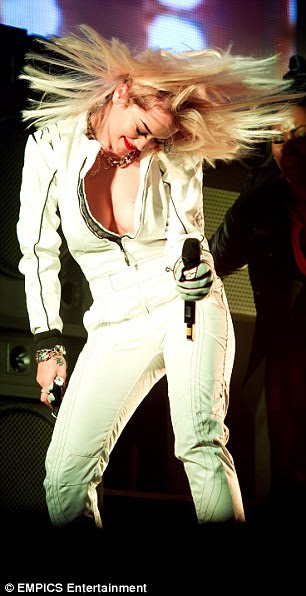 Energetic: It's little wonder the 21-year-old star was the victim of a little overexposure with her combination of a plunging white leather catsuit and some seriously lively dance moves 