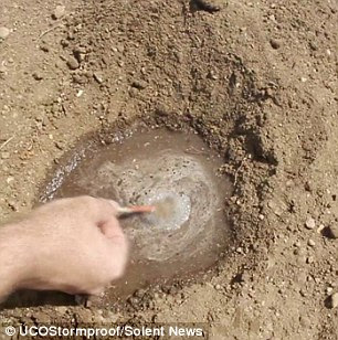 Here the match is shown being dipped into water