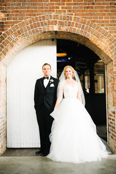 Preparations, pre-ceremony, reveal, bridal party and family formals photography at Emmanuel Lutheran Church and Prairie St. Brewhouse in Rockford, IL before an early Spring wedding. Wedding photographer – Ryan Davis Photography – Rockford, Illinois.