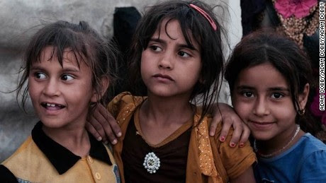 Girls play at the refugee camp in Abu Ghraib, Iraq.