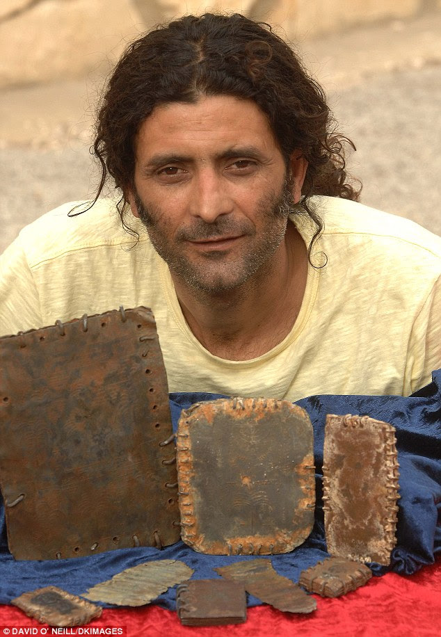 One lucky owner: Hassan Saida with some of the artefacts that he says he inherited