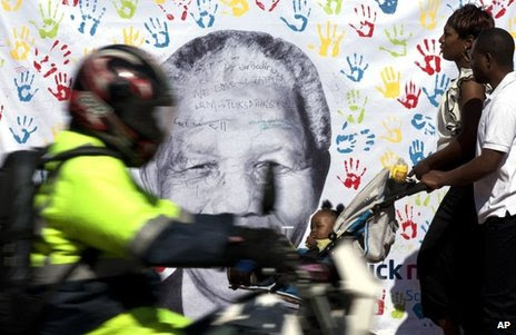 A banner of Nelson Mandela hangs outside his hospital in Pretoria, 19 July 