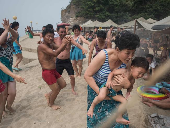North Koreans getting down on the beach. Picture: Ed Jones